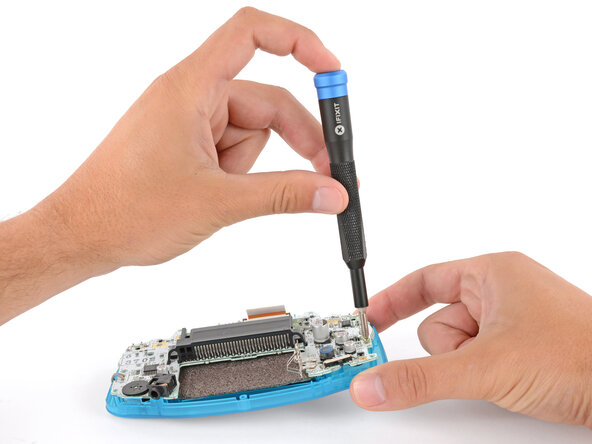 How to Reshell Your Game Boy Advance, Install the motherboard screws: crwdns2935265:027crwdnd2935265:01crwdnd2935265:03crwdne2935265:0