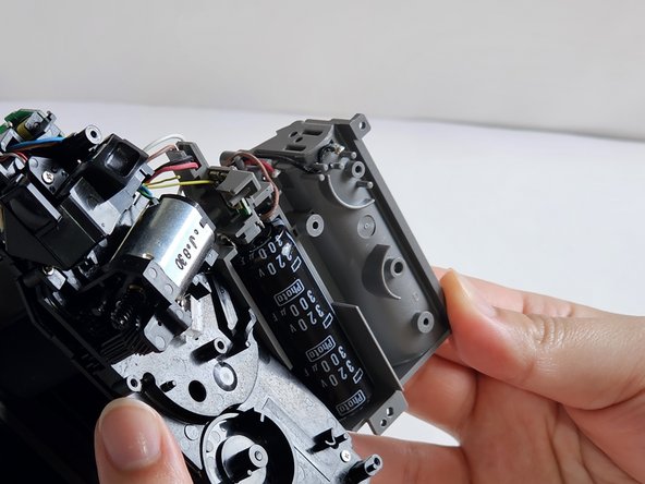 Fujifilm Instax Mini 9 Flash Capacitor Replacement, Remove Battery Slot: crwdns2935265:010crwdnd2935265:02crwdnd2935265:02crwdne2935265:0