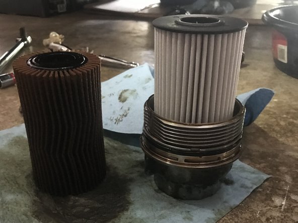 Remove the old oil filter from oil filter canister and replace with the new one.