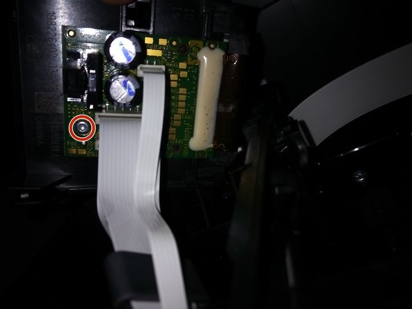 Gently remove the PCB by unscrewing the two torx screws (highlighted in red circles).