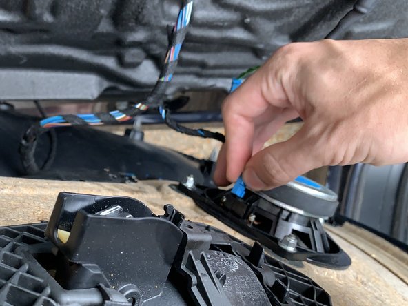 Unplug the speaker wire by pulling it straight out.