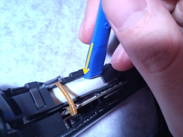 Valve Index Controller Right Index Controller Battery Replacement, Remove the adhesive, then the battery: crwdns2935265:04crwdnd2935265:02crwdnd2935265:03crwdne2935265:0