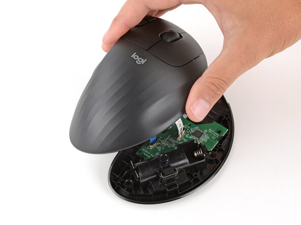 How to Open Your Logitech Ergo M575S, Reposition the top half: crwdns2935265:011crwdnd2935265:02crwdnd2935265:03crwdne2935265:0