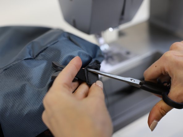 How to Replace a Backpack Buckle (with sewing), Stitch the bottom buckle in place: crwdns2935265:04crwdnd2935265:02crwdnd2935265:02crwdne2935265:0