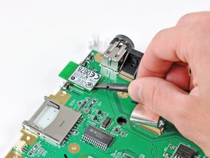 Remplacement du sytème des batteries de recharge par induction de éa Wii -  Tutoriel de réparation iFixit