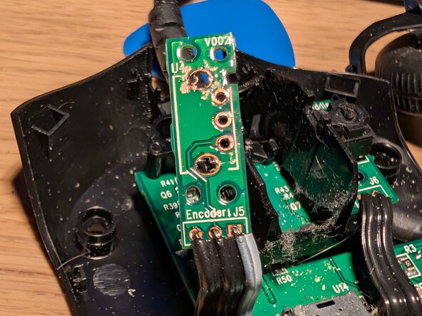 Replacing the scroll wheel encoder on the Logitech G403 Wired, Clean up and new sensor: step 6, image 1 of 3