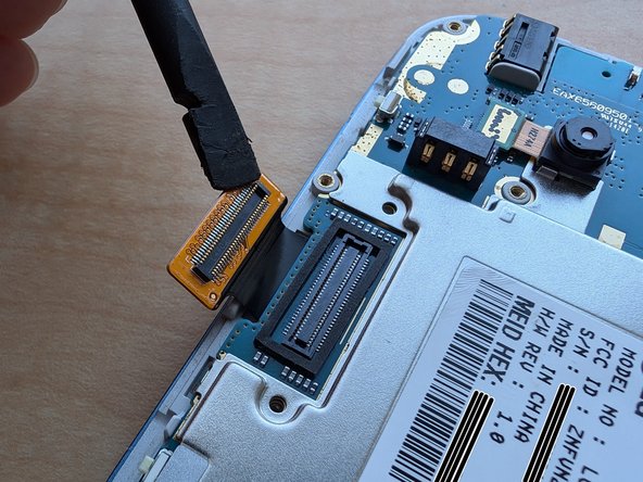 LG Extravert 2 Teardown, Detatch the display ribbon cable: crwdns2935265:06crwdnd2935265:02crwdnd2935265:02crwdne2935265:0