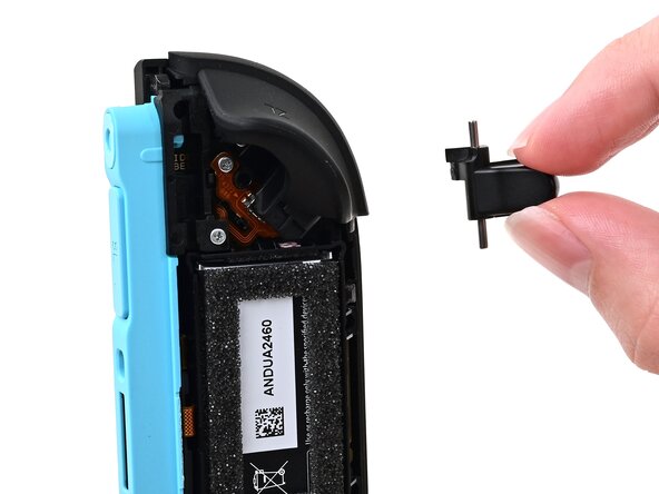 Joy-Con 2 (Left) Battery Replacement, Install the release button: crwdns2935265:018crwdnd2935265:01crwdnd2935265:03crwdne2935265:0
