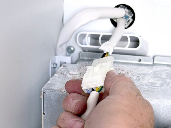 Frigidaire Side-By-Side Refrigerator Evaporator Fan Cover Removal, Disconnect the icemaker: crwdns2935265:05crwdnd2935265:02crwdnd2935265:03crwdne2935265:0