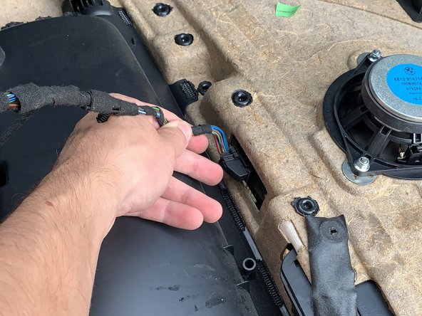 Unplug the control panel wire by rotating the lever that is built into the plug.