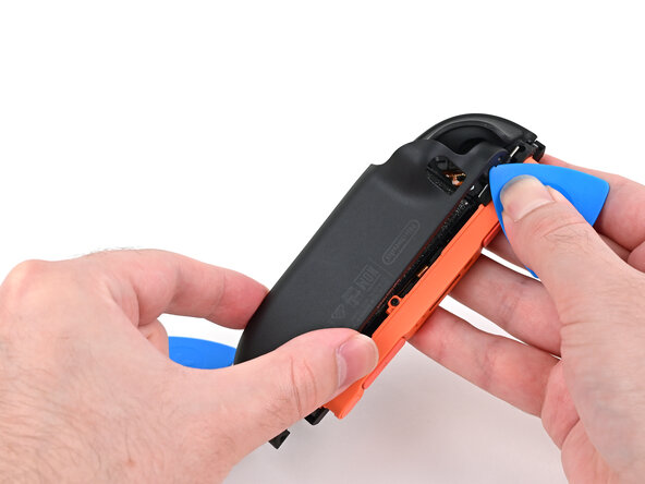 Joy-Con 2 (Right) Joystick Replacement, Release the back cover: crwdns2935265:09crwdnd2935265:02crwdnd2935265:03crwdne2935265:0