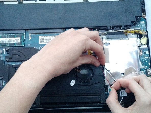 Lenovo IdeaPad Y40-70 Laptop Fan Replacement, Loosen the speaker connectors: crwdns2935265:04crwdnd2935265:03crwdnd2935265:03crwdne2935265:0