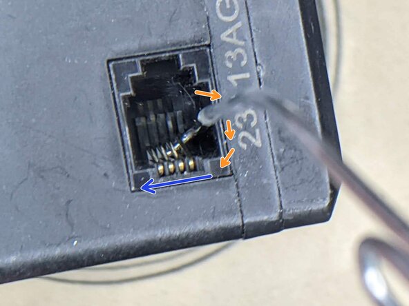 VEX V5 smart motor crushed pin repair, Insert the paperclip: crwdns2935265:03crwdnd2935265:01crwdnd2935265:01crwdne2935265:0