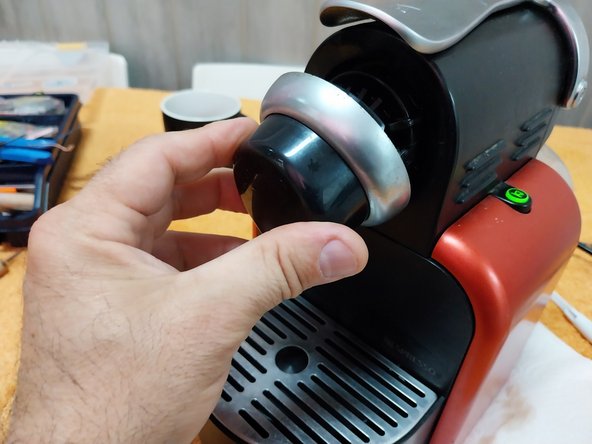 Nespresso Delonghi EN 95.R coffee machine Cleaning parrot beak coffee outlet clogged (Leaks coffee into case).: step 23, image 3 of 3