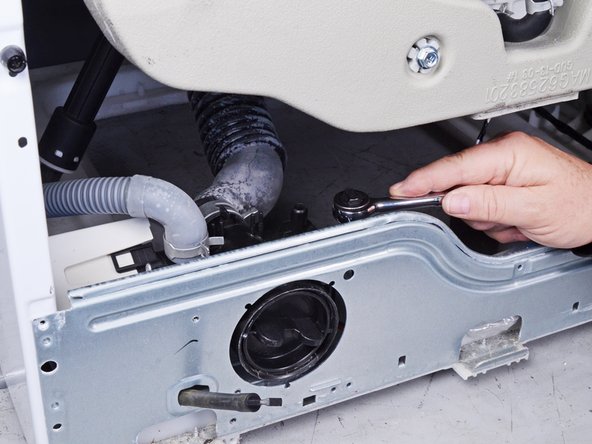 LG Front Load Washing Machine Drain Pump Motor Replacement, Unfasten the pump assembly: crwdns2935265:035crwdnd2935265:02crwdnd2935265:02crwdne2935265:0