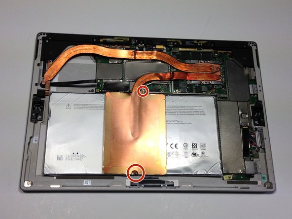 Remove the two 1.5mm Torx T3 screws holding the copper plate near the middle of the device.