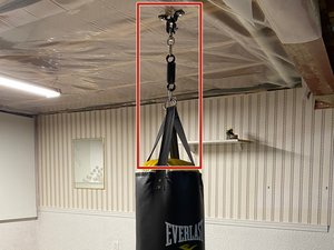 hanging a punching bag from ceiling joists