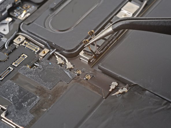 iPad Pro 11" 3rd Gen Battery Replacement, Disconnect the two 5G mmWave antenna coaxial cables: crwdns2935265:047crwdnd2935265:03crwdnd2935265:03crwdne2935265:0