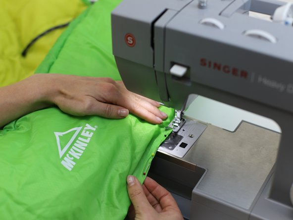 How to Repair a Tear in a Sleeping Bag, Stitch the area: crwdns2935265:03crwdnd2935265:03crwdnd2935265:03crwdne2935265:0
