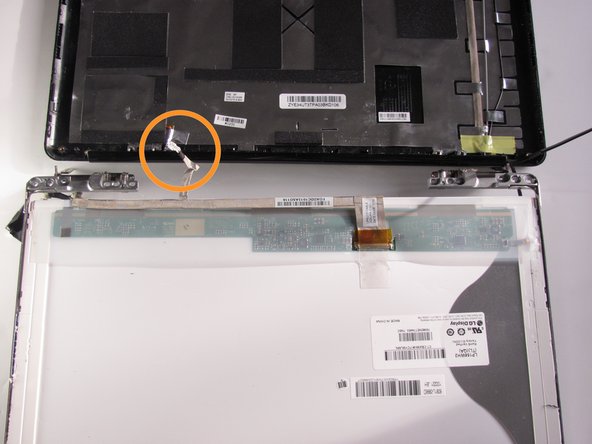 Place the LCD Monitor next to the display panel by flipping it over the display hinges.