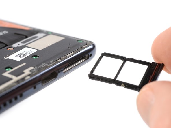 Xiaomi Mi 10 Lite Screen Replacement, Eject the SIM card tray: crwdns2935265:013crwdnd2935265:03crwdnd2935265:03crwdne2935265:0