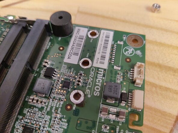 MICROS Compact Workstation 3 (310) Hard Drive Replacement, insert ssd and screw down: crwdns2935265:03crwdnd2935265:02crwdnd2935265:03crwdne2935265:0