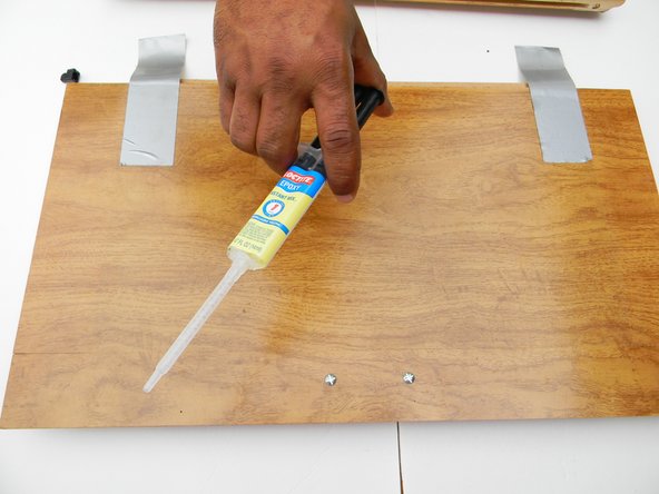 This is a 5 minute  quick setting 2 part wood epoxy. Take the top off the epoxy.  Connect the syringe tip and lock it in place. Press the plunger so you can fill the needle tip with epoxy.