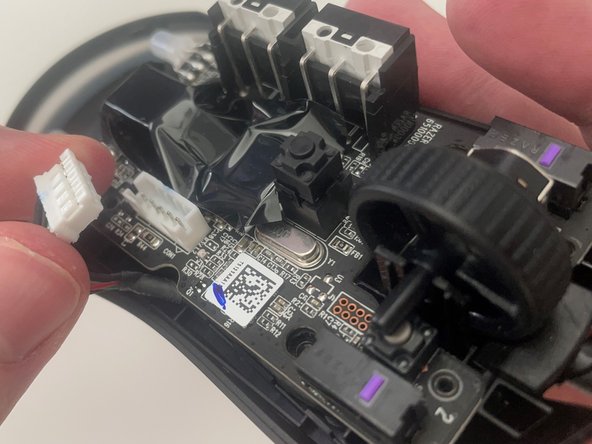 Razer Viper Mini Trigger Switches Replacement, Disconnect the Ribbon Connector: crwdns2935265:05crwdnd2935265:02crwdnd2935265:02crwdne2935265:0