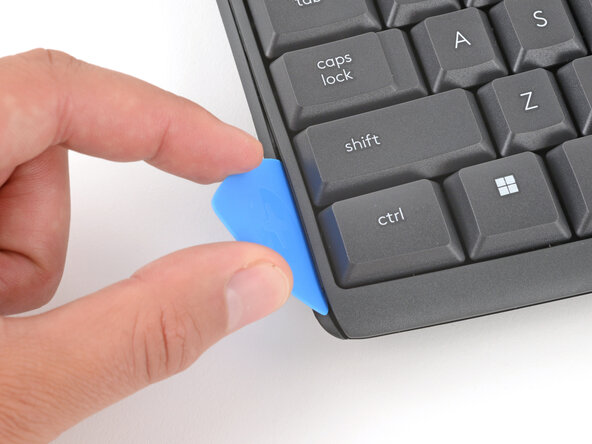 How to Open Your Logitech K295 Keyboard, Insert an opening pick: crwdns2935265:06crwdnd2935265:02crwdnd2935265:03crwdne2935265:0