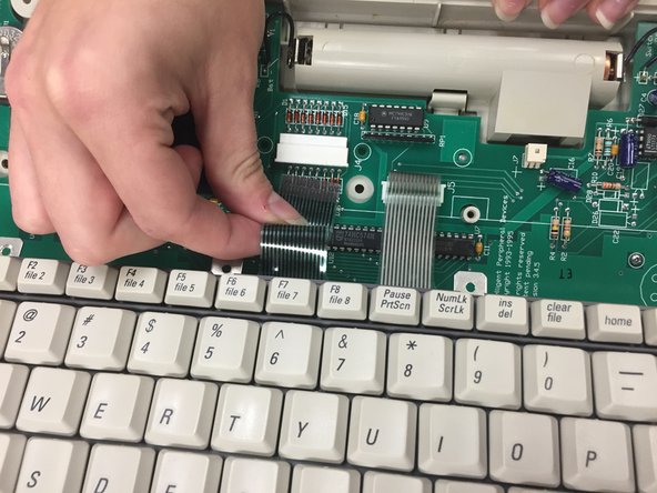 AlphaSmart Pro Motherboard Replacement, Detaching keyboard Ribbon Cables: crwdns2935265:04crwdnd2935265:03crwdnd2935265:03crwdne2935265:0