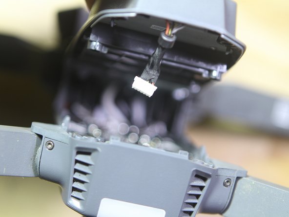 DJI Mavic Pro Top Case Removal, Disconnect GPS From Logic Board: crwdns2935265:07crwdnd2935265:03crwdnd2935265:03crwdne2935265:0