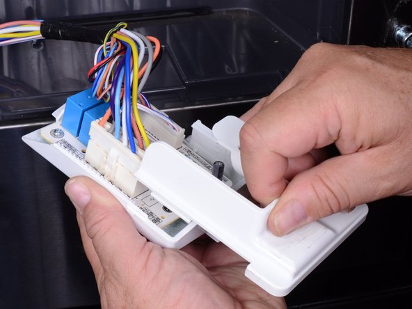 LG Refrigerator LFX25973 Dispenser PC Board Replacement, Release the circuit board holder cover: crwdns2935265:013crwdnd2935265:03crwdnd2935265:03crwdne2935265:0