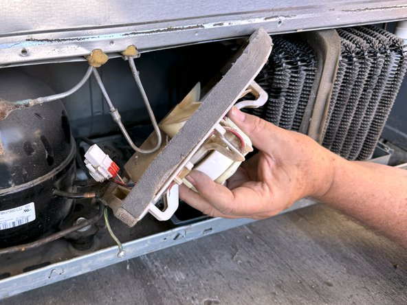 Samsung Older French Door Refrigerator Condenser Fan Replacement, Rotate the fan bracket to free it: step 7, image 3 of 3