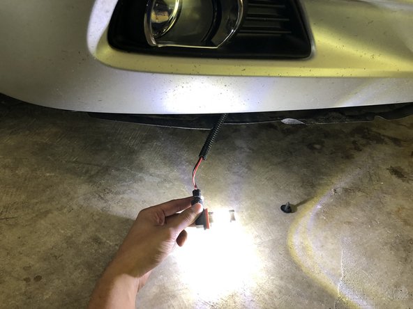 2009 Toyota Camry SE Fog light bulb, lamp, and housing Replacement, Replace the fog light bulb: step 5, image 2 of 2