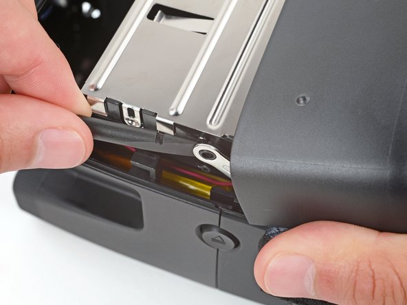 Polaroid Flip Film Door Replacement, Unclip the film door: crwdns2935265:08crwdnd2935265:02crwdnd2935265:03crwdne2935265:0