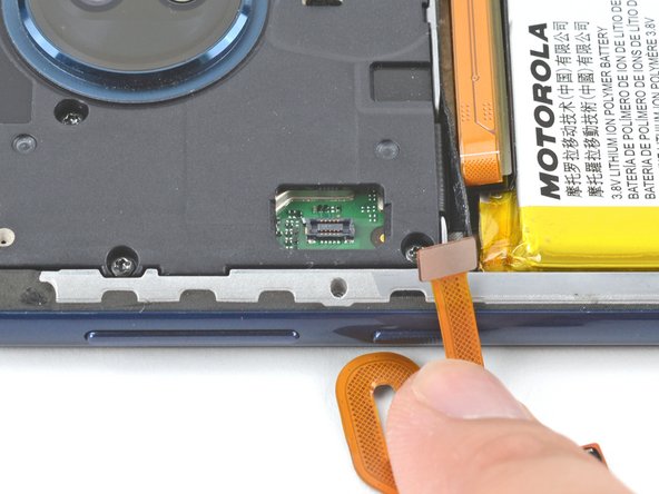Use the pointed end of a spudger to pry up on the fingerprint sensor connector to disconnect it.