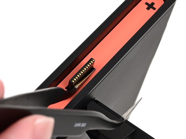 Nintendo Switch 2 Microphone Replacement, Pry up the right side sticker: crwdns2935265:05crwdnd2935265:01crwdnd2935265:03crwdne2935265:0