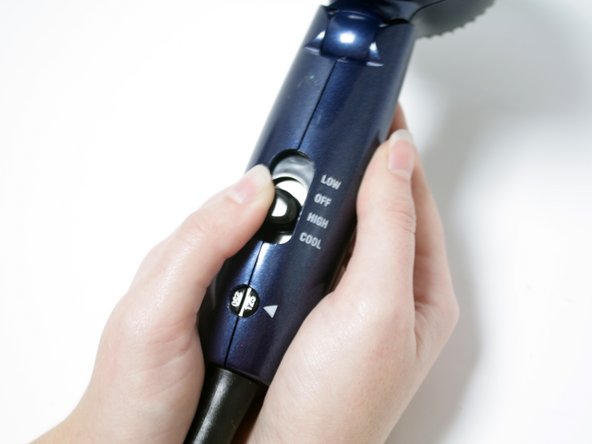 Warm up the hair dryer by turning it on the highest heat setting.