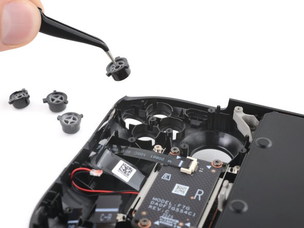 Steam Deck OLED Front Shell Replacement, Remove the action buttons: crwdns2935265:060crwdnd2935265:03crwdnd2935265:03crwdne2935265:0