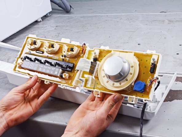 LG Front Load Washing Machine Control Panel Replacement, Remove the control panel board: crwdns2935265:013crwdnd2935265:03crwdnd2935265:03crwdne2935265:0