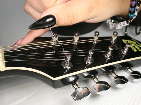 How to Replace the Strings on your Rogue RM-100A A-Style Mandolin: step 6, image 2 of 3