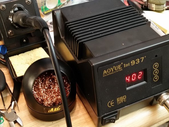 This step is only necessary if your upper LCD is bad. Unfortunately, this is a common problem. First, wet the contacts with flux. Then, with your iron at 400 degrees C, melt the solder and remove all four wires. It might help to add fresh solder with lead. The lead-free solder used by Nintendo sucks.