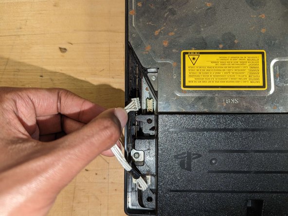 PlayStation 3 Slim Thermal Paste Replacement, Power supply removal: crwdns2935265:07crwdnd2935265:02crwdnd2935265:03crwdne2935265:0