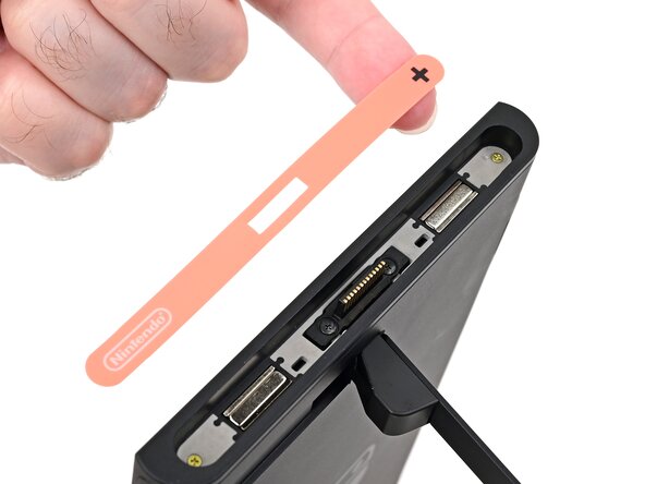 Nintendo Switch 2 Microphone Replacement, Remove the right side sticker: crwdns2935265:08crwdnd2935265:03crwdnd2935265:03crwdne2935265:0