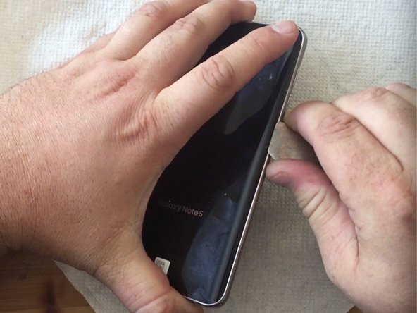 How to replace Samsung Galaxy Note 5 motherboard, Remove the Galaxy Note 5 battery door.: crwdns2935265:02crwdnd2935265:02crwdnd2935265:02crwdne2935265:0