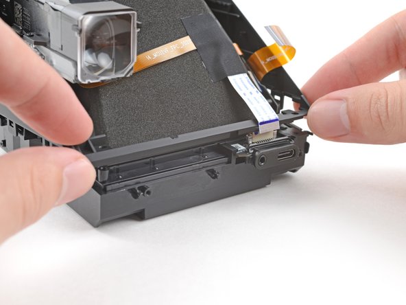 Polaroid I-2 USB-C Port Board Replacement, Reposition the front cover: crwdns2935265:036crwdnd2935265:02crwdnd2935265:02crwdne2935265:0