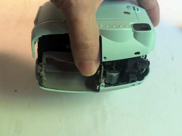 Fujifilm Instax Mini 9 Camera Shell Replacement, Remove the Rear Cover: crwdns2935265:013crwdnd2935265:02crwdnd2935265:03crwdne2935265:0