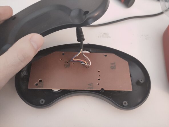 Power Player Super Joy III - Second Player Controller Teardown, Remove the back cover.: step 3, image 2 of 2