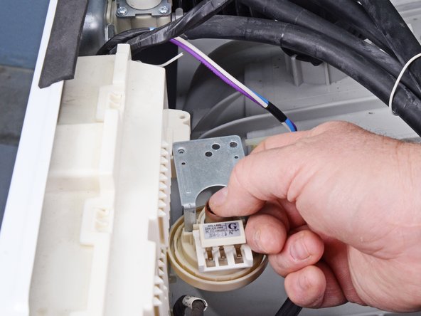 LG Front Load Washing Machine Pressure Sensor Replacement, Remove the pressure sensor: crwdns2935265:08crwdnd2935265:03crwdnd2935265:03crwdne2935265:0