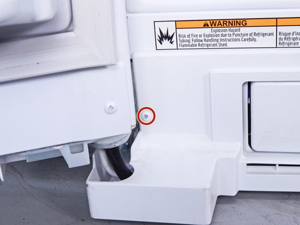 How to Clean the Condenser Coils in your Whirlpool Refrigerator, Unfasten the front panel: crwdns2935265:05crwdnd2935265:02crwdnd2935265:03crwdne2935265:0
